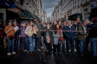 PARIS, FRANCE - DECEMBER 23: The local community watch and react at the scene of a fatal shooting in the multi-cultural neighbourhood of Strasbourg-Saint Denis in Paris which left three dead and several people injured on December 23, 2022 in Paris, France. Police detained a 69-year-old man in connection with the attack, which took place in the 10th district, not far from Gare de l'Est station and a Kurdish cultural center. (Photo by Kiran Ridley/Getty Images)