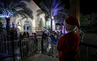 A child in a Santa suit in Gaza city