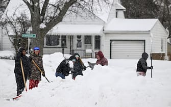 NEW YORK, UNITED STATES - DECEMBER 26: Citizens shovel snow after snowfall in Buffalo, New York, United States on December 26, 2022. (Photo by Fatih Aktas/Anadolu Agency via Getty Images)