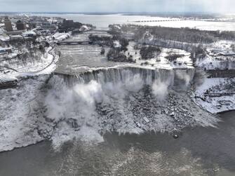 NIAGARA FALLS, NEW YORK - DECEMBER 27: An aerial view of the partially frozen Niagara Falls, which is on the border with Canada, on December 27, 2022 in Niagara Falls, New York. A massive winter storm hit much of the United States in recent days. (Photo by Lokman Vural Elibol/Anadolu Agency via Getty Images)