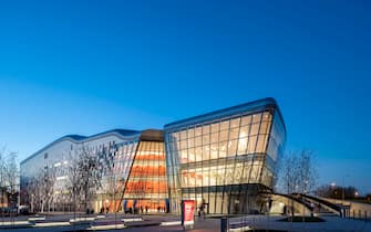 Dusk elevation with lit interiors. ICE Krakow Congress Center, KrakÃ³w, Poland. Architect: Ingarden & Ewy, Ararta Isozaki, 2014. (Photo by: Inigo Bujedo Aguirre/View Pictures/Universal Images Group via Getty Images)