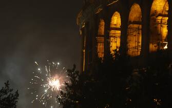 ROME, ITALY - JANUARY 1: Fireworks go off during new year celebrations over the Colosseum in Rome, Italy, on January 1, 2023. (Photo by Riccardo De Luca/Anadolu Agency via Getty Images)