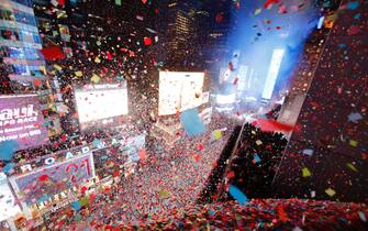 NEW YORK, NY - JANUARY 1: Confetti falls on revelers as they celebrate New Year's Eve in Times Square on January 1, 2023, in New York City. (Photo by Gary Hershorn/Getty Images)