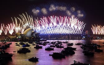 SYDNEY, AUSTRALIA - JANUARY 01: The midnight fireworks are seen over the Sydney Opera House and Sydney Harbour Bridge during New Yearâs Eve celebrations in Sydney, Australia, on Sunday, January 01, 2023. (Photo by Stringer/Anadolu Agency via Getty Images)