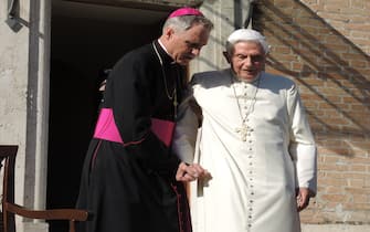 Pope Emeritus Benedict XVI (R), born Joseph Ratzinger, is assisted by his personal secretary Georg Gaenswein, on his way of the Mater Ecclesiae (lit. Mother of the Church) Monastery located inside the Vatican Gardens in Vatican City, 17 April 2017. Pope Emeritus Benedict XVI has been residing at this location since his resignation in 2013. Photo: Lena Klimkeit/dpa