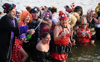 epa10385256 Enthusiasts of winter swimming take a cold bath during the New Year's celebrations in the Gravel Swimming Pools in Rzeszow, southeastern Poland, 01 January 2023.  EPA/DAREK DELMANOWICZ POLAND OUT
