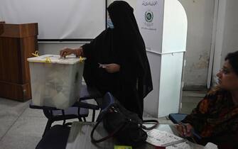epa10076163 A woman casts her vote at a polling station during the elections of 20 provincial assembly seats in the most populous province of Punjab, in Lahore, Pakistan, 17 July 2022. The by-election on 17 July, for 20 assembly seats in the most populous state of Punjab will be a popularity test for former prime minister Imran Khan. The vote is viewed as a possible indicator of the national elections that must be held by October of next year, although Khan has campaigned across the nation for an early election since he was removed from office in April by a vote of no confidence.  EPA/RAHAT DAR