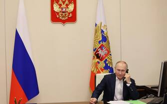 RUSSIA PUTIN CHARITY epa10387431 Russian President Vladimir Putin talks on the phone with an eight year old Agatha Bylkova from the Kurgan region, a participant of the Fir Tree of Wishes charity campaign, in Moscow, Russia, 03 January 2023. On 22 December 2022, the President during a charity campaign, chose a postcard with a girl's New Year's wish to see the northern lights and ride a reindeer sleigh. EPA/MIKHAEL KLIMENTYEV / SPUTNIK / KREMLIN POOL MANDATORY CREDIT