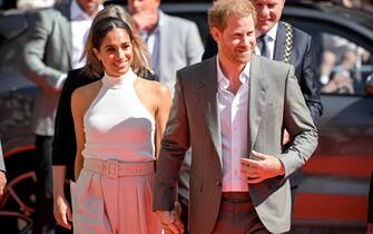 Britain's Prince Harry (R) and his wife Meghan (L), the Duke and Duchess of Sussex, arrive for their visit to represent the '6th Invictus Games 2023', in Duesseldorf, Germany, 06 September 2022. ANSA/SASCHA STEINBACH