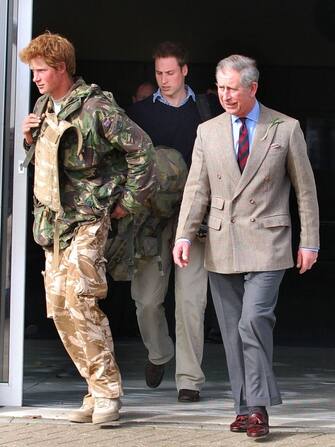 - PRINCE HARRY IS MET BY HIS FATHER PRINCE CHARLES AND BROTHER WILLIAM UPON ARRIVING AT RAF BRIZE NORTON IN OXFORDSHIRE HAVING BEEN FORCED TO CUT SHORT HIS TOUR OF DUTY IN AFGHANISTAN DUE A A FOREIGN PRESS LEAK. PICTURES /., Credit:Barry Clack / Avalon