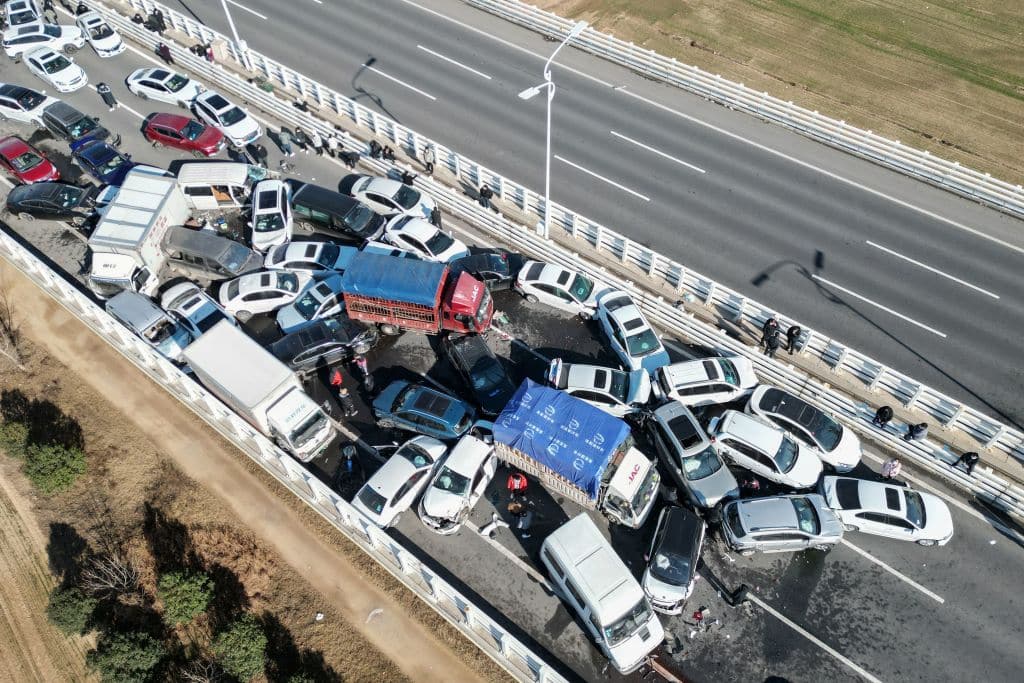 TOPSHOT - This aerial photo taken on December 28, 2022 shows a multi-vehicle collision on Zhengxin Yellow River Bridge in Zhengzhou, in China's central Henan province. - China OUT (Photo by AFP) / China OUT (Photo by STR/AFP via Getty Images)