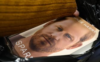 LONDON, ENGLAND - JANUARY 10: Copies of "Spare" by Prince Harry are unwrapped from protective packaging as they go on sale at one minutes after midnight in WH Smith bookstore at Victoria Station on January 10, 2023 in London, England. Prince Harry's memoir "Spare", released on Tuesday, is already No 1 in the Amazon bestseller charts and one of the biggest pre-order titles for high-street retailers. (Photo by Leon Neal/Getty Images)