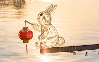 HANGZHOU, CHINA - JANUARY 11: A rowboat equipped with a rabbit-shaped lantern is docked at the West Lake to welcome the Chinese Lunar New Year, the Year of the Rabbit, on January 11, 2023 in Hangzhou, Zhejiang Province of China. (Photo by VCG/VCG via Getty Images)