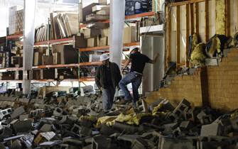 USA WEATHER TORNADO GEORGIA epa10402427 Workers assess tornado damage to the 18 Wheeler Truck Parts & Chrome warehouse following a tornado outbreak across multiple states in Austell, Georgia, USA, 12 January 2023. EPA/ERIK S. LESSER