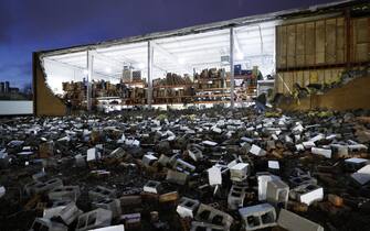 USA WEATHER TORNADO GEORGIA epa10402426 Workers assess tornado damage to the 18 Wheeler Truck Parts & Chrome warehouse following a tornado outbreak across multiple states in Austell, Georgia, USA, 12 January 2023. EPA/ERIK S. LESSER