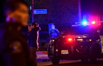 1246436597 Police patrol the scene along Garvey Avenue in Monterey Park, California, on January 21, 2023, where police are responding to reports of multiple people shot. (Photo by Frederic J. BROWN / AFP) (Photo by FREDERIC J. BROWN/AFP via Getty Images)