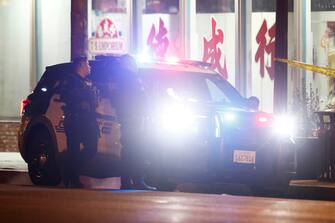 USA SHOOTING epa10422112 Police officers stand watch after reports of a shooting taking place in Monterey Park, California, USA, 22 January 2023. According to law enforcement officials the shooting took place during a Lunar New Year celebration in downtown Monterey Park. It is not immediately known how many people were injured during the incident. EPA/CAROLINE BREHMAN