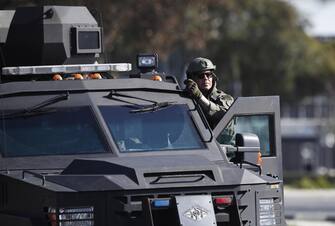 epa10423969 A Los Angeles County Sheriff SWAT vehicle leaves as investigators go through a white van which police reported was connected with a mass shooting at a dance studio in Monterey Park, California, after police entered the vehicle and found dead body in Torrance, California, USA, 22 January 2023. The shooting killed ten and wounded ten more during a Lunar New Year celebration according to the Los Angeles County Sheriff's Department.  EPA/CAROLINE BREHMAN