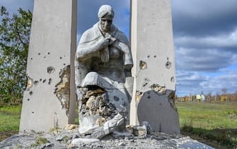 A damaged statue is pictured in the Kherson border region village, outside of Mykolaiv, on October 31, 2022. (Photo by BULENT KILIC / AFP) (Photo by BULENT KILIC/AFP via Getty Images)