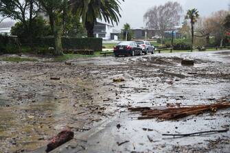 Debris is seen left strewn on a street in Nelson on August 18, 2022, after the city experienced flash floods caused by a storm. - Hundreds of families on New Zealand's South Island were forced to leave their homes on August 18 after flooding caused a state of emergency to be declared in three regions. (Photo by Chris Symes / AFP) (Photo by CHRIS SYMES/AFP via Getty Images)