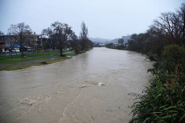 A general view of the Maitai river after it burst its banks in Nelson on August 18, 2022, as the city experienced flash floods caused by a storm. - Hundreds of families on New Zealand's South Island were forced to leave their homes on August 18 after flooding caused a state of emergency to be declared in three regions. (Photo by CHRIS SYMES / AFP) (Photo by CHRIS SYMES/AFP via Getty Images)