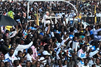 TOPSHOT - Pope Francis (C) back arrives for the mass at the N'Dolo Airport in Kinshasa, Democratic Republic of Congo (DRC), on February 1, 2023. (Photo by Tiziana FABI / AFP) (Photo by TIZIANA FABI/AFP via Getty Images)