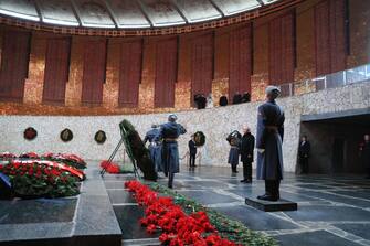 Russian President Vladimir Putin lays a wreath to the Eternal Flame at the Hall of Military Glory at the Mamayev Kurgan World War Two Memorial complex in Volgograd on February 2, 2023, during commemorations for the 80th anniversary of the Soviet victory at the Battle of Stalingrad during WWII. (Photo by Dmitry Lobakin / SPUTNIK / AFP) (Photo by DMITRY LOBAKIN/SPUTNIK/AFP via Getty Images)