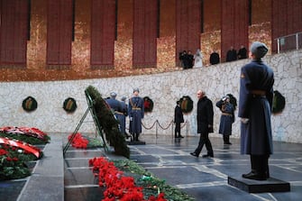 Russian President Vladimir Putin lays a wreath to the Eternal Flame at the Hall of Military Glory at the Mamayev Kurgan World War Two Memorial complex in Volgograd on February 2, 2023, during commemorations for the 80th anniversary of the Soviet victory at the Battle of Stalingrad during WWII. (Photo by Dmitry LOBAKIN / SPUTNIK / AFP) (Photo by DMITRY LOBAKIN/SPUTNIK/AFP via Getty Images)