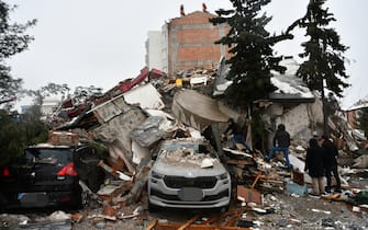 KAHRAMANMARAS, TURKIYE - FEBRUARY 06: A view of debris as search and rescue works continue after a 7.4 magnitude earthquake hit southern provinces of Turkiye, in Kahramanmaras, Turkiye on February 6, 2023. The 7.4 magnitude earthquake jolted Turkiyeâs southern province of Kahramanmaras early Monday, according to Turkiyeâs Disaster and Emergency Management Authority (AFAD). It was followed by a magnitude 6.4 quake that struck southeastern Gaziantep province. A third earthquake with a 6.5 magnitude also hit Gaziantep. Earthquakes had affected several provinces including, Osmaniye, Malatya, AdÄ±yaman, Adana, DiyarbakÄ±r, Kilis and Sanliurfa. (Photo by Adsiz Gunebakan/Anadolu Agency via Getty Images)