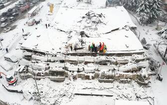 MALATYA, TURKIYE - FEBRUARY 07: An aerial view of collapsed building as search and rescue efforts continue in Malatya after 7.7 and 7.6 magnitude earthquakes hit Kahramanmaras, Turkiye on February 7, 2023. Early Monday morning, a strong 7.7 earthquake, centered in the Pazarcik district, jolted Kahramanmaras and strongly shook several provinces, including Gaziantep, Sanliurfa, Diyarbakir, Adana, Adiyaman, Malatya, Osmaniye, Hatay, and Kilis. Later, at 13.24 p.m. (1024GMT), a 7.6 magnitude quake centered in Kahramanmaras' Elbistan district struck the region. Turkiye declared 7 days of national mourning after deadly earthquakes in southern provinces. (Photo by Hakan Burak Altunoz/Anadolu Agency via Getty Images)