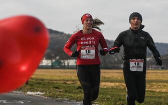 KRAKOW, POLAND - FEBRUARY 12 : Couples take part in the Valentine's Day 5km run in Krakow, Poland on February 12, 2023. (Photo by Omar Marques/Anadolu Agency via Getty Images)