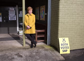 epa09181719 SNP leader Nicola Sturgeon looks on as Glasgow voters head to St  Francis  Primary School in the Gorbals, Glasgow, Scotland, Britain, 06 May 2021. Scotland holds parliamentary elections amid coronavirus pandemic and calls for a second referendum on Scottish independence.  EPA/ROBERT PERRY