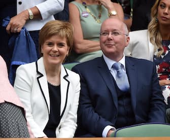 epa05418305 Scottish First Minister Nicola Sturgeon and her husband Peter Murell in the Royal Box on Centre Court prior to the men's singles final between Andy Murray and Milos Raonic during the Wimbledon Championships at the All England Lawn Tennis Club, in London, Britain, 10 July 2016.  EPA/ANDY RAIN EDITORIAL USE ONLY/NO COMMERCIAL SALES
