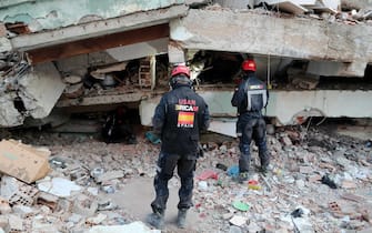 epa10459340 Members of the Spanish search and rescue team inspect the area of a building collapse in the aftermath of a powerful earthquake in Hatay, Turkey 10 February 2023. Over 22,000 people were killed and thousands more were injured after two major earthquakes struck southern Turkey and northern Syria on 06 February. Authorities fear the death toll will keep climbing as rescuers look for survivors across the region.  EPA/ERDEM SAHIN