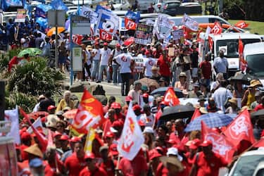 Protesters take part in a demonstration on the fifth day of nationwide rallies organised since the start of the year, against a deeply unpopular pensions overhaul, in Saint-Denis-de-la-Reunion, on the French overseas island of La Reunion, on February 16, 2023. (Photo by Richard BOUHET / AFP) (Photo by RICHARD BOUHET/AFP via Getty Images)