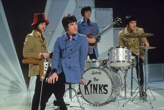 The Kinks, (LR) Dave Davies, Ray Davies, Peter Quaife, and Mick Avory, wait on the set of a television show, ready to perform, 1968. (Photo by Hulton Archive/Getty Images)