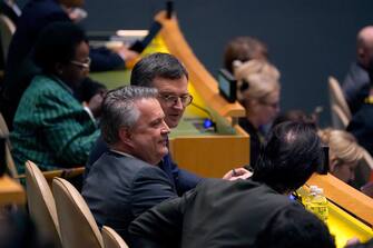 UN-DIPLOMACY-UKRAINE-RUSSIA-CONFLICT-RESOLUTION-VOTE Ukrainian Foreign Minister Dmytro Kuleba and Ukrainian Ambassador to the UN Sergiy Kyslytsya speak after the vote during the Eleventh Emergency Special Session of the General Assembly on Ukraine, at UN headquarters in New York City on February 23, 2023. - The United Nations voted overwhelmingly Thursday to demand Russia "immediately" and "unconditionally" withdraw its troops from Ukraine, marking the one-year anniversary of the war with a call for a "just and lasting" peace. (Photo by TIMOTHY A. CLARY / AFP)