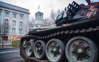 24 February 2023, Berlin: A Russian T-72 B1 tank destroyed by an anti-tank mine stands on the street Unter den Linden directly in front of the building of the Russian Embassy. The Russian army had invaded Ukraine on 24.02.2022. Photo: Paul Zinken/dpa (Photo by Paul Zinken/picture alliance via Getty Images)