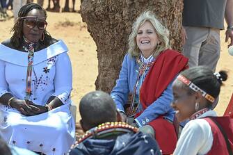US First Lady Jill Biden (2nd R) interacts with women from the Maasai community at Loseti village in Kajiado county, Kenya, on February 26, 2023 where she heard about the impoverishing impact of drought to the herder community during the third day of her visit to Kenya where she toured a drought response site to highlight the impacts of drought on communities. (Photo by Tony KARUMBA / AFP) (Photo by TONY KARUMBA/AFP via Getty Images)