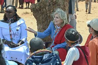 US First Lady Jill Biden (C) meets with women from the Maasai community at Loseti village in Kajiado county, Kenya, on February 26, 2023 where she heard about the impoverishing impact of drought to the herder community during the third day of her visit to Kenya where she toured a drought response site to highlight the impacts of drought on communities.  (Photo by Tony KARUMBA/AFP) (Photo by TONY KARUMBA/AFP via Getty Images)