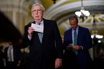 WASHINGTON, DC - FEBRUARY 14: Senate Minority Leader Mitch McConnell (R-KY) pulls notes from his pocket before briefing reporters following the weekly Senate Republican policy luncheon in the U.S. Capitol on February 14, 2023 in Washington, DC. Republicans were critical of President Joe Biden's response to the U.S. Military's downing of four unidentified objects that entered North American airspace in the last eight days and McConnell re-emphasized that the country would not default on its debts by failing to raise the debt limit.  (Photo by Chip Somodevilla/Getty Images)