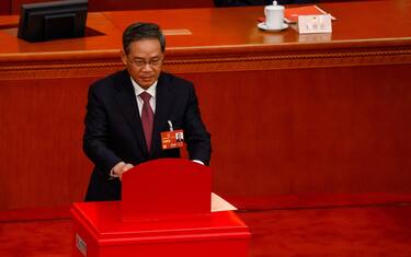 epa10512804 Member of the Politburo Li Qiang casts his vote during the Third Plenary Session of the National People's Congress (NPC) at the Great Hall of the People, in Beijing, China, 10 March 2023. China holds two major annual political meetings, the National People's Congress (NPC) and the Chinese People's Political Consultative Conference (CPPCC) which run alongside and together are known as 'Lianghui' or 'Two Sessions'. EPA/MARK R. CRISTINO / POOL