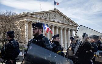 FRANCE GOVERNMENT PENSION epa10526166 Police officers secure the access to the National Assembly as Labour Unions members demonstrate against the pensions system reform in Paris, France, 16 March 2023. The Assembly is expected to vote on the controversial pension reform law after the Senate voted in favour. EPA/CHRISTOPHE PETIT TESSON