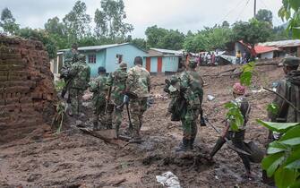Malawi Defence Force, (MDF) soldiers work to recover bodies of victims of landslides which occurred due to heavy rains resulting from cyclone Freddy during an MDF rescue operation at Manje informal settlement in Blantyre, southern Malawi on March 16, 2023. - As the rains ceased for the first time in five days, Malawi began the process of recovering bodies from cyclone Freddy-induced mudslides.
A joint operation by the military and members of the local communities recovered five bodies on March 16, 2023 from the mud. (Photo by Amos Gumulira / AFP) (Photo by AMOS GUMULIRA/AFP via Getty Images)