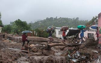 1248253307 People repatriate residents and their property from a flood affected Chimwankhunda location in Blantyre on March 14, 2023 following heavy rains caused by cyclone Freddy. - The death toll from Cyclone Freddy in Malawi and Mozambique passed 200 on March 14, 2023 after the record-breaking storm triggered floods and landslips in its second strike on Africa in less than three weeks.
Rescue workers warned that more victims were likely as they scoured destroyed neighbourhoods for survivors even as hopes dwindled.
The fierce storm delivered its second punch to southeastern Africa starting at the weekend, its second landfall since late February after brewing off Australia and traversing the Indian Ocean.
Malawi's government said at least 190 people were killed with 584 injured and 37 missing, while authorities in neighbouring Mozambique reported 20 deaths and 24 injured. (Photo by Amos Gumulira / AFP) (Photo by AMOS GUMULIRA/AFP via Getty Images)