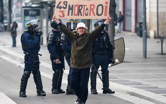- A protester holds a placard reading   49.3 Death of the king  during a demonstration after the French government pushed a pensions reform through parliament without a vote, using the article 49.3 of the constitution, in Nantes, western France, on March 18, 2023. The French president on March 16 rammed a controversial pension reform through parliament without a vote, deploying a rarely used constitutional power that risks inflaming protests. The move was an admission that his government lacked a majority in the National Assembly to pass the legislation to raise the retirement age from 62 to 64.//SALOM-GOMIS_n038/Credit:Sebastien SALOM-GOMIS/SIPA/2303182022