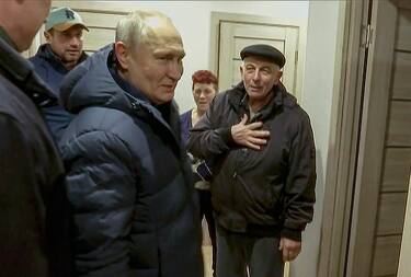 epa10532082 A still image taken from a handout video provided by the Russian President's press service on 19 March 2023 shows Russian President Vladimir Putin visit an apartment of local residents during his visit to Mariupol,  eastern Ukraine, late 18 March 2023. Putin visited the Russian-occupied city after he visited Crimea on the ninth anniversary of Russia's annexation of the Black Sea peninsula. According to the Kremlin, Putin had conversations with local residents, visited an apartment of one of the locals, assessed new roads, and followed the construction of new facilities in the city. On 24 February 2022 Russian troops entered the Ukrainian territory in what the Russian president declared to be a 'Special Military Operation', starting an armed conflict that has provoked destruction and a humanitarian crisis.  EPA/RUSSIAN PRESIDENT PRESS SERVICE/HANDOUT HANDOUT BEST QUALITY AVAILABLE HANDOUT EDITORIAL USE ONLY/NO SALES