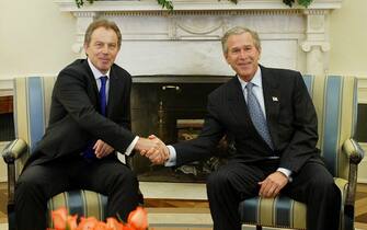 epa05410203 (FILE) A file photo dated 16 April 2004 showing then US President George W. Bush (R) shaking hands with then British Prime Minister Tony Blair in the Oval Office at the White House, Washington, USA. The report by Sir John Chilcot on whether it was right and neccessary to invade Iraq concluded 06 July 2016 the invasion and subsequent war against Iraq was 'not the last resort'. Chilcot also said US and British policy on Iraq based on 'flawed intelligence and assessments'.  EPA/SHAWN THEW