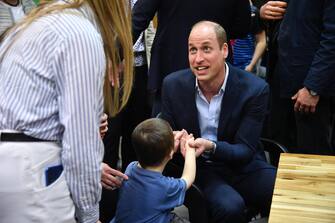 epa10537494 Britain's Prince William, the Prince of Wales chats with children during his visit to refugees reception center for Ukrainians in Mokotow district in Warsaw, Poland, 22 March 2023. Britain's Prince William is paying a surprise visit to Poland during which he met with Polish and British soldiers in Rzeszow and visited a refugee center for Ukrainians.  EPA/RADEK PIETRUSZKA POLAND OUT