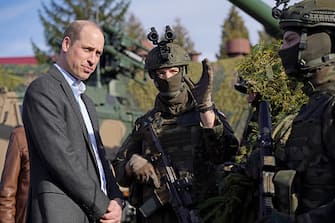 RZESZOW, POLAND - MARCH 22: Prince William, The Prince of Wales (left) meeting members of the Polish military during a visit to the 3rd Brigade Territorial Defense Force base that has been heavily involved in providing support to Ukraine on March 22, 2023 in Warsaw, Poland.  Prince William is meeting with the Polish Defense Minister, Mariusz Blaszczak, and speaking to Polish and British troops to learn about the strong companionship they have formed since working together to support Ukraine.  (Photo by Yui Mok - Pool/Getty Images)